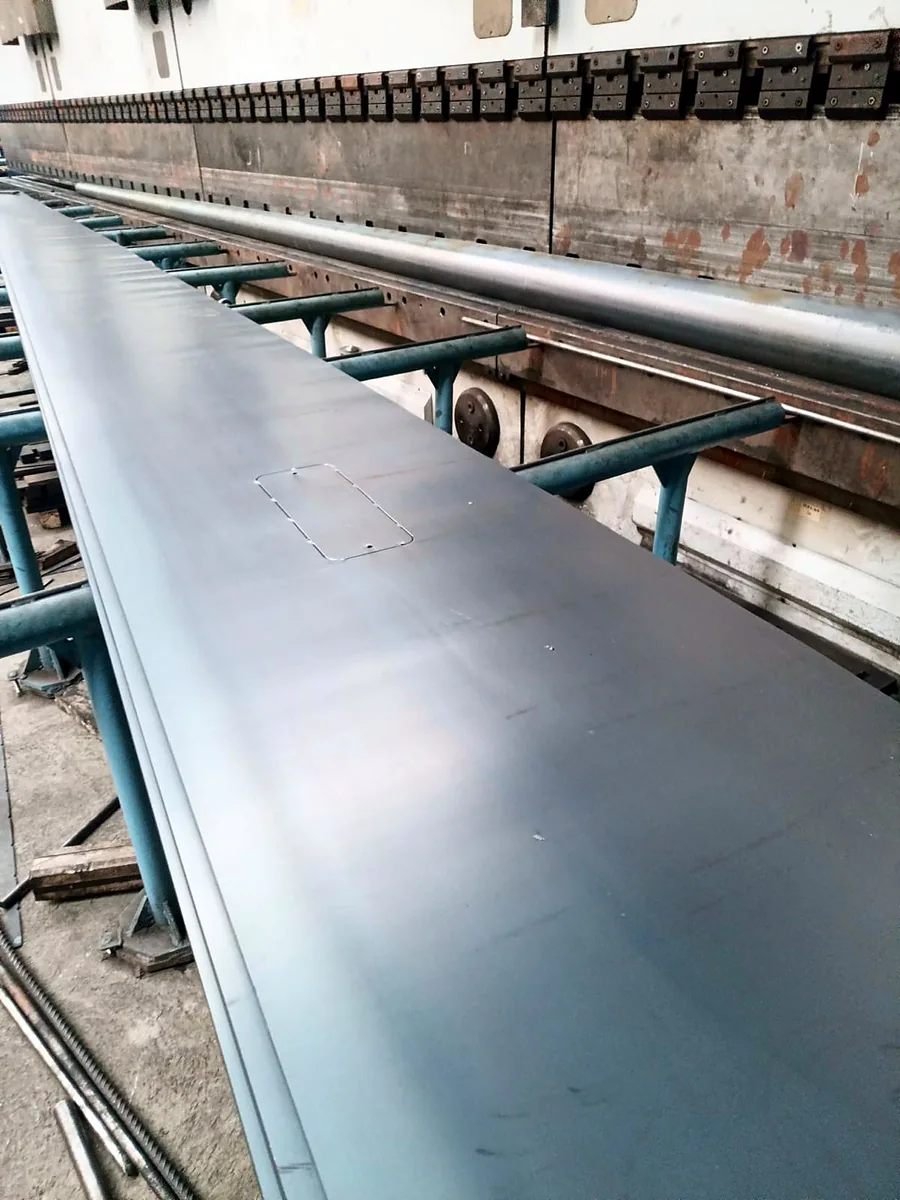 Press brake folding a tapered steel lighting pole body at the Artay factory